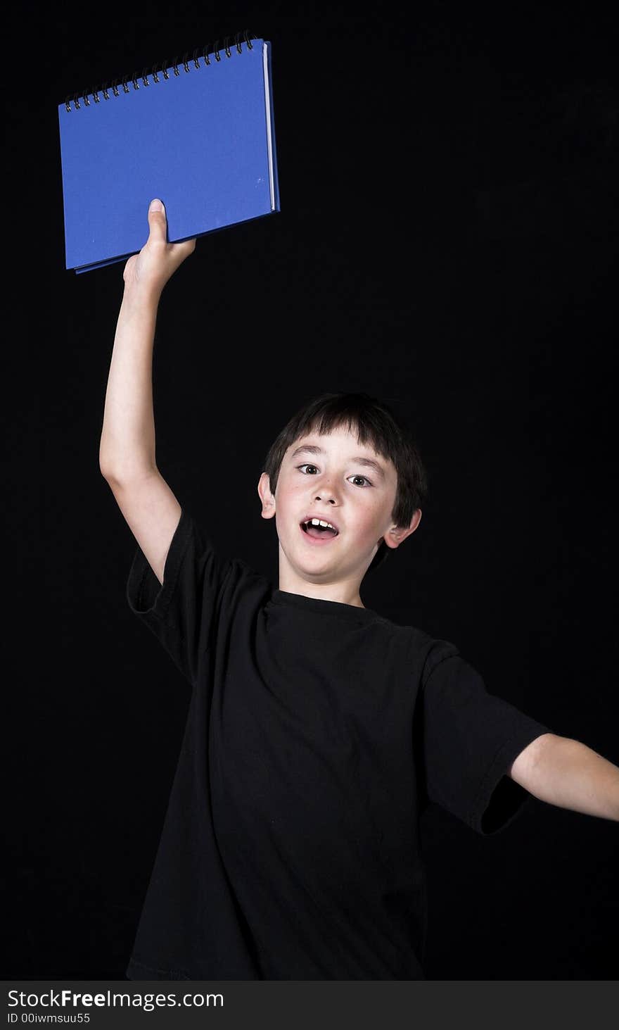 Boy posing for back to school theme over black background