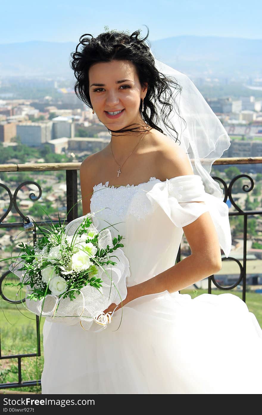 The beautiful bride with a bouquet of flowers