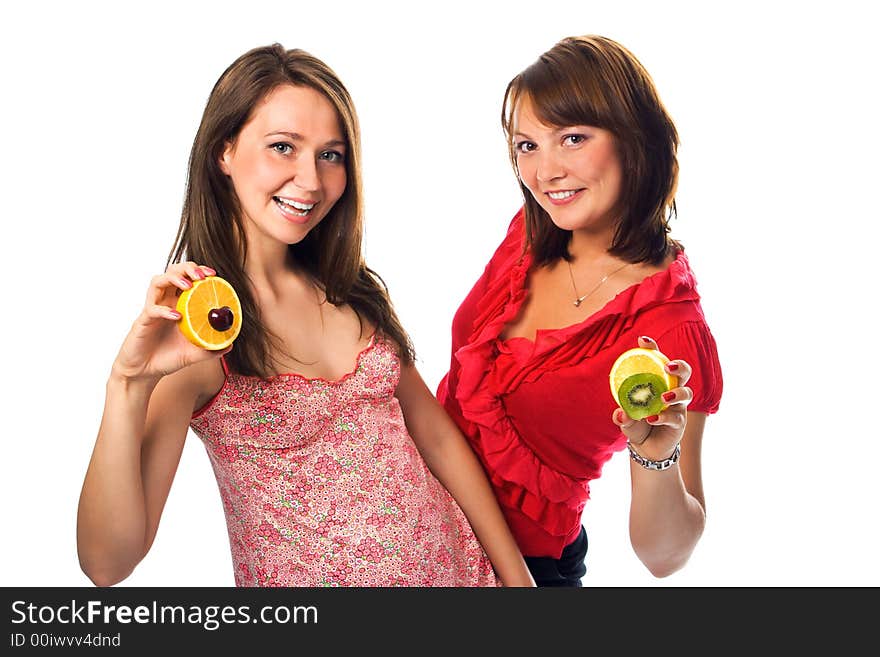 Two young woman with fruit on white