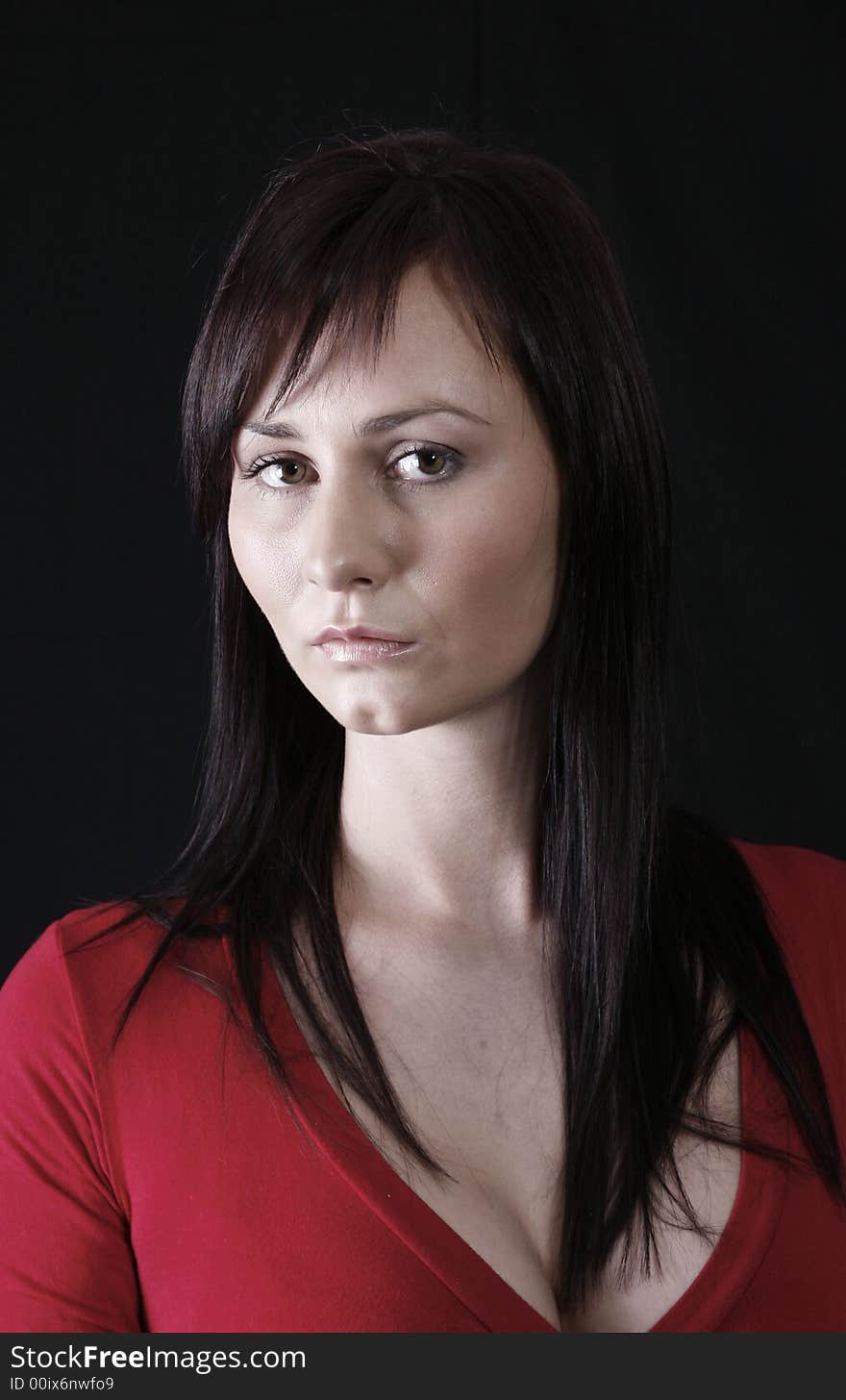 Pretty girl in red top, black background