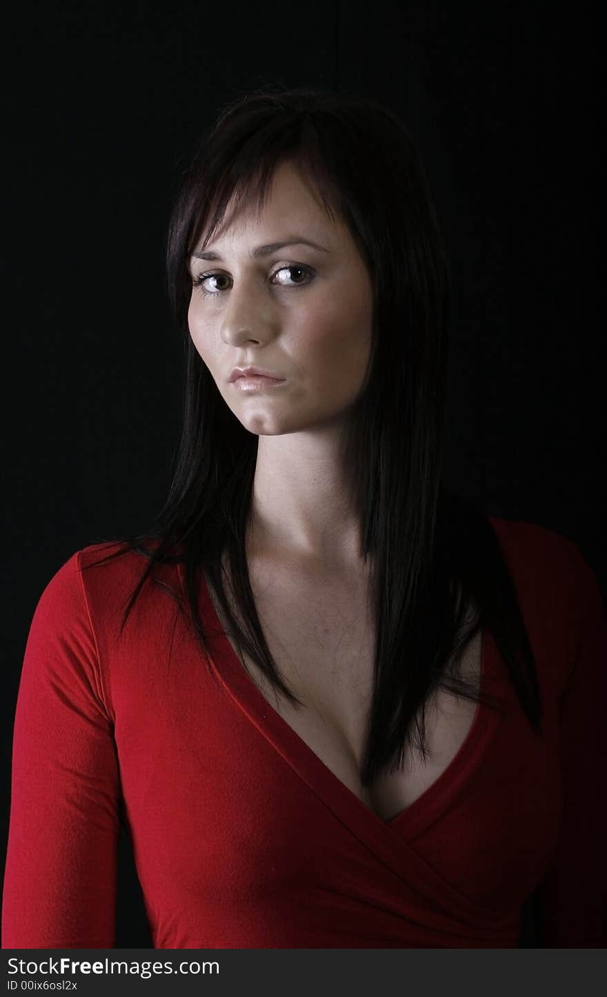 Pretty girl in red top, black background