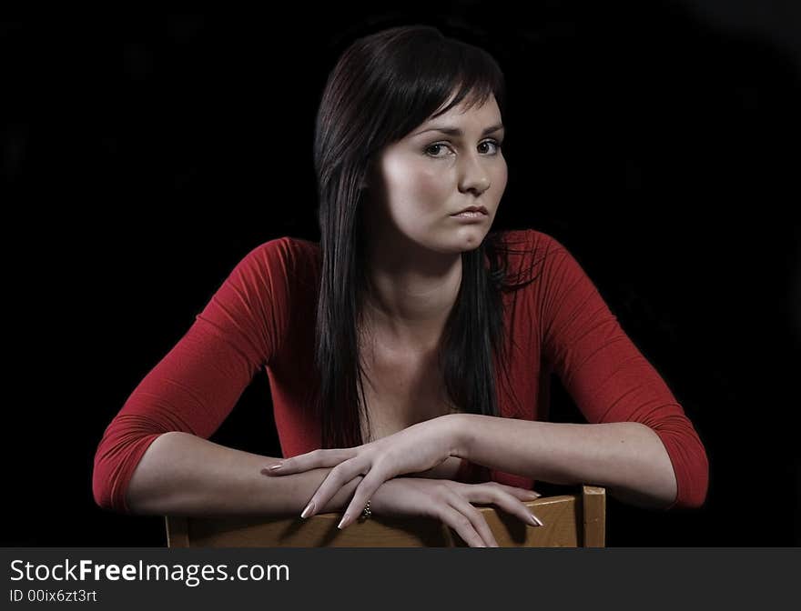 Pretty girl in red top, black background