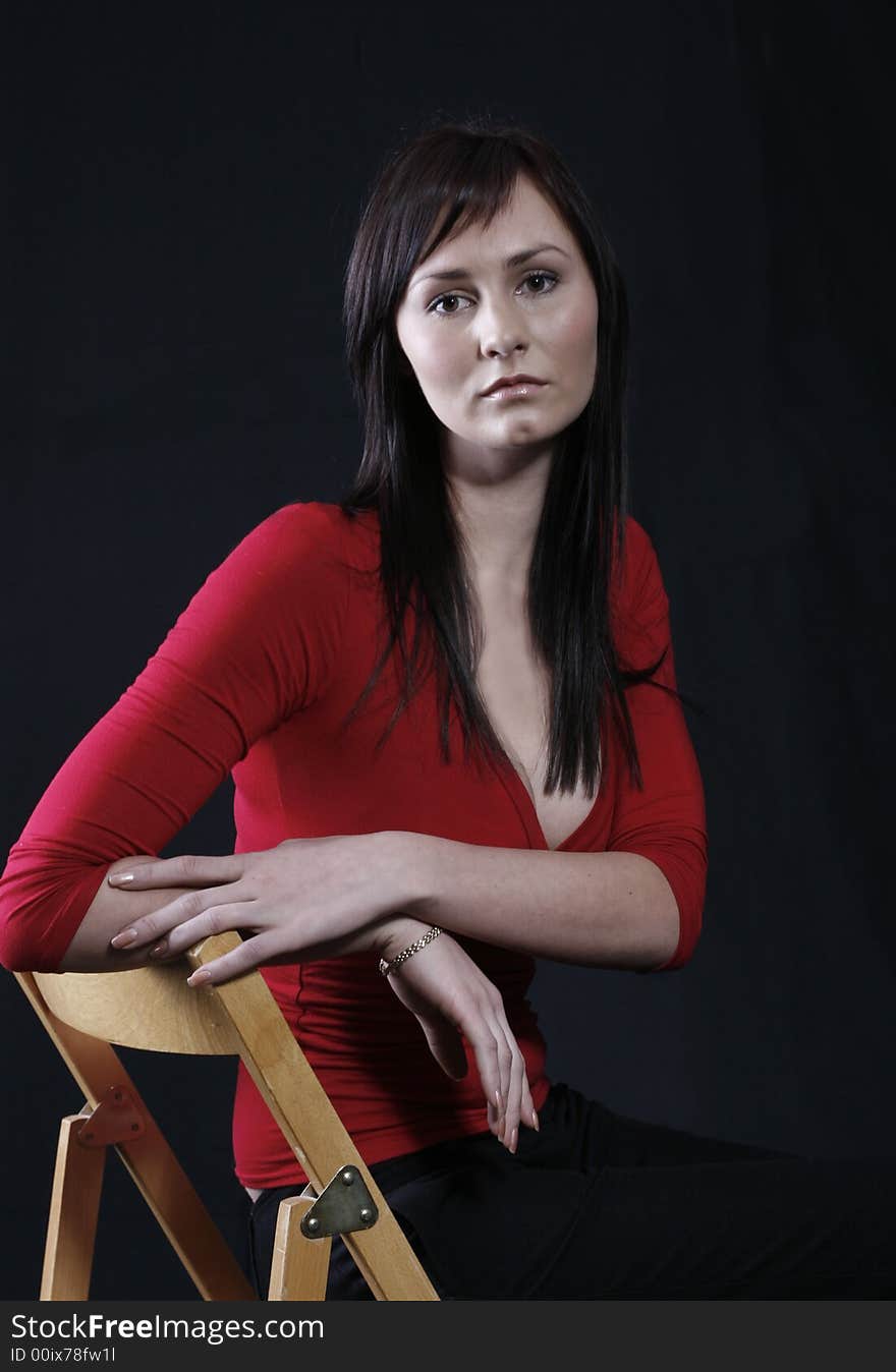 Pretty girl in red top, black background