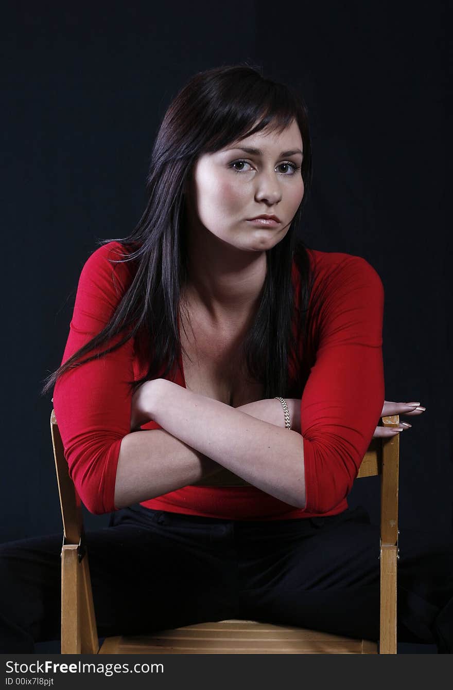 Pretty girl in red top, black background