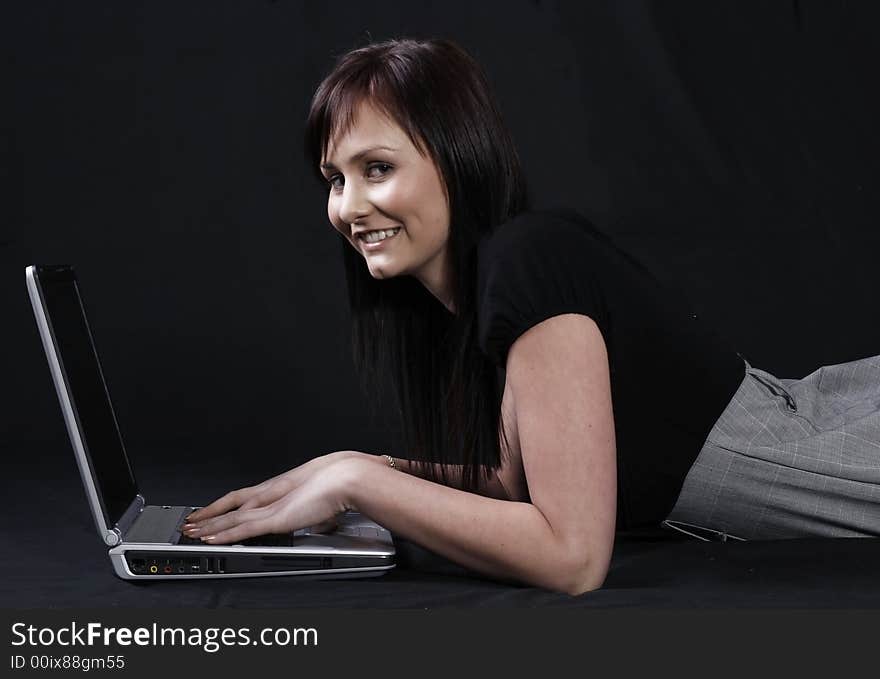 young pretty women relaxing and using laptop computer. young pretty women relaxing and using laptop computer