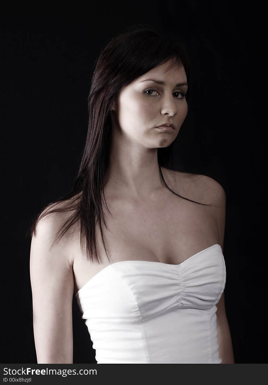 Pretty girl in white top, black background