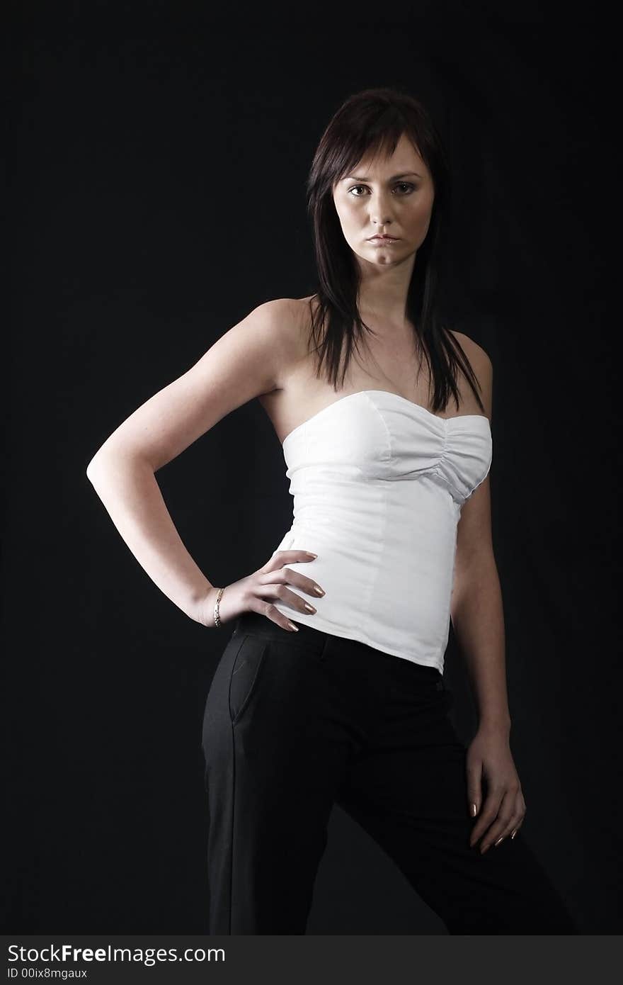 Pretty girl in white top, black background