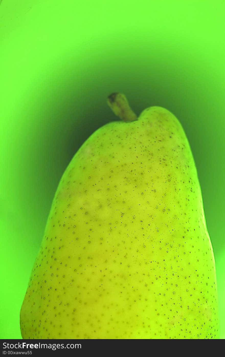 Green pear on a green background