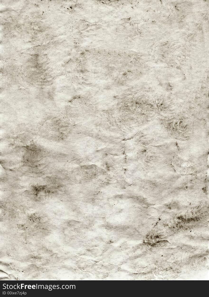 Grey grunge background of paper which is blotchy