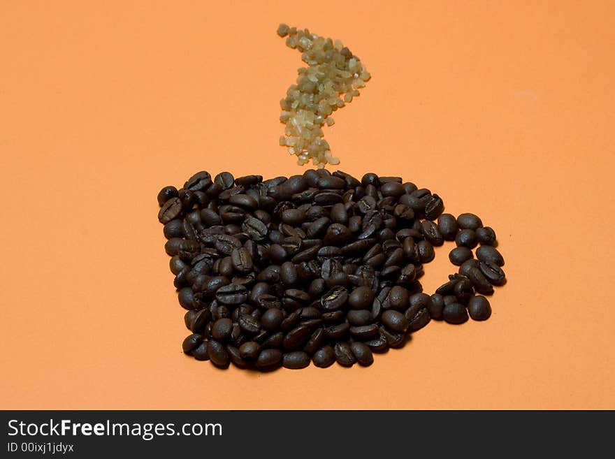 Cup of coffee on orange background