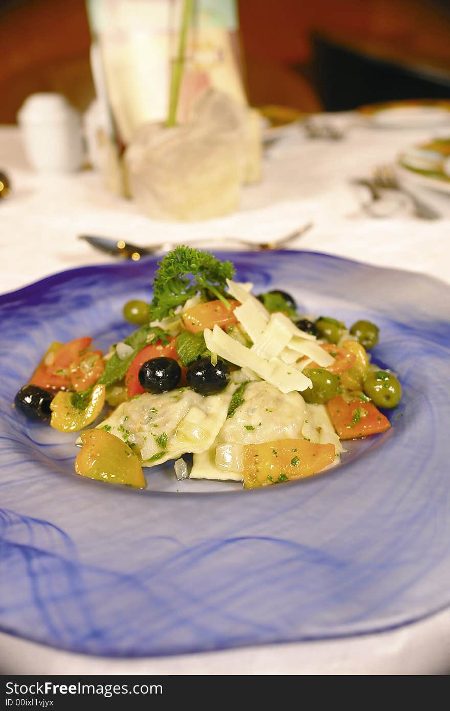 Homemade italian stuffed ravioli with green and black olives