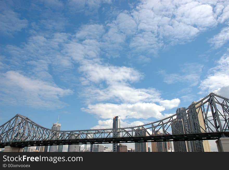 Brisbane Story bridge against blue sky and skyscrapers background