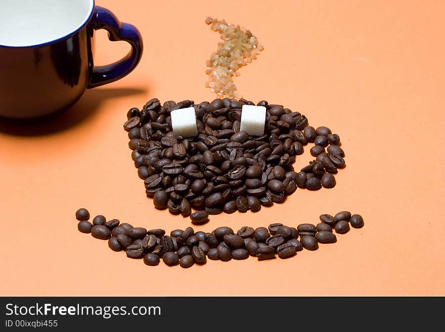 Cup of coffee on orange background