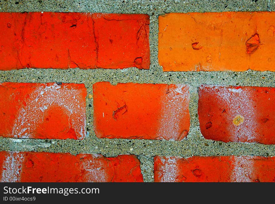 A portion of a red brick wall.