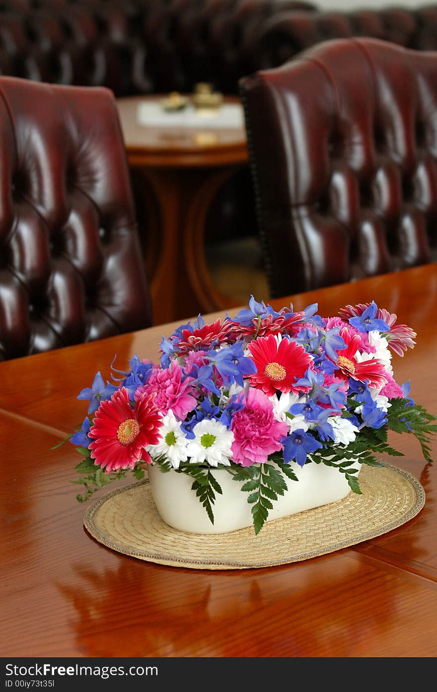 A table with seets decorated by flowers. A table with seets decorated by flowers