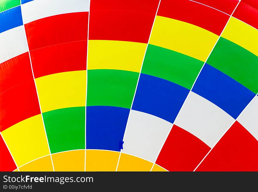 Close up of a hot air balloon showing a colorful mosaic pattern.