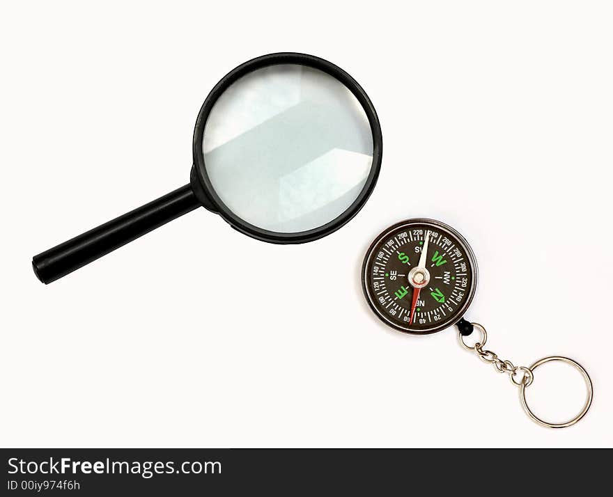 An picture of magnifier and compass. An picture of magnifier and compass