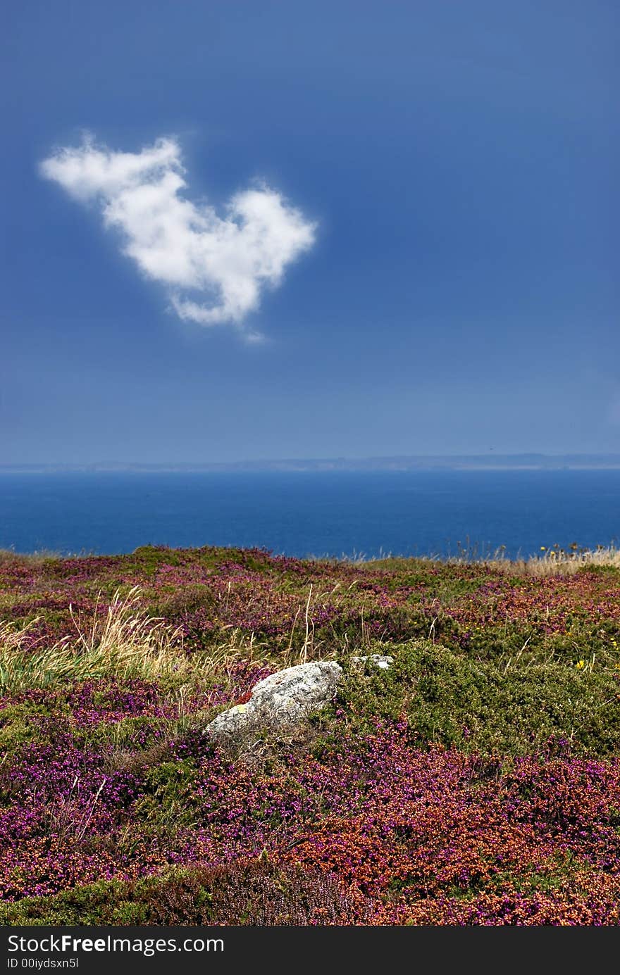 Raz Point in Britany, vertical photography with one cloud