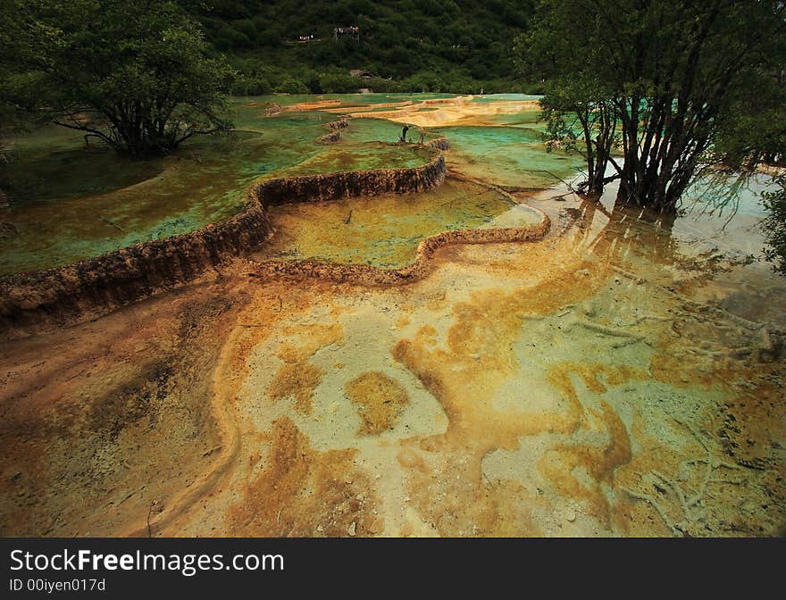 Limestone formations and hot springs in the Huanglong Valley, China. Limestone formations and hot springs in the Huanglong Valley, China.