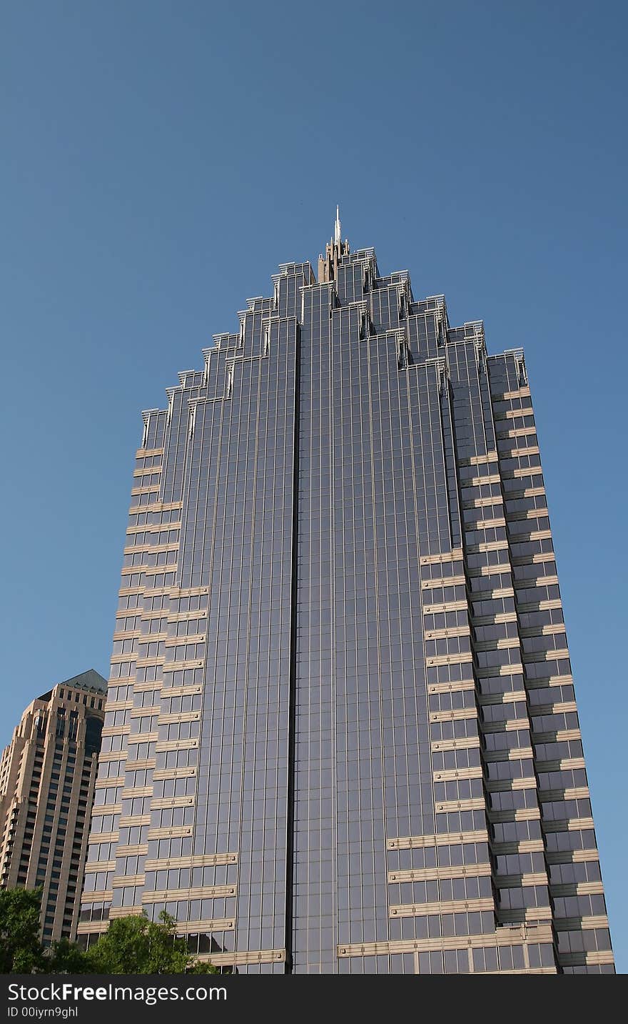 A modern office tower of pink stone and glass. A modern office tower of pink stone and glass