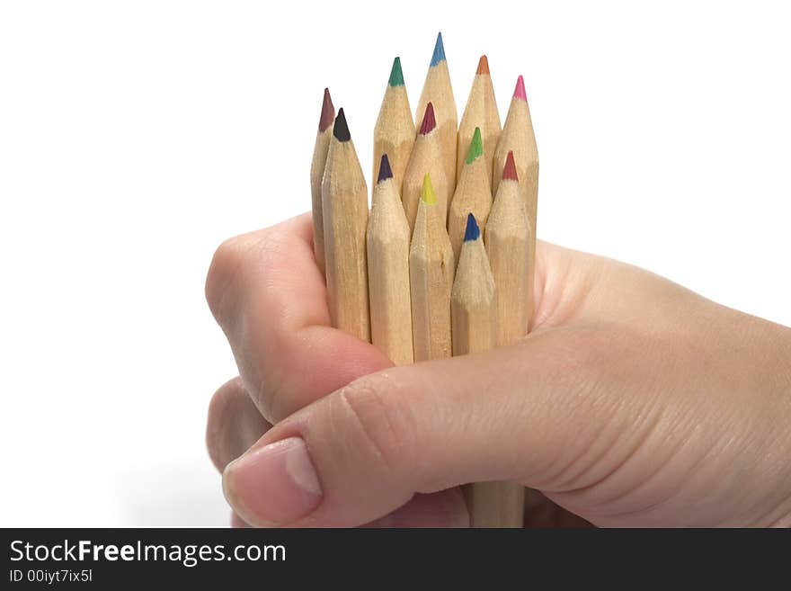 Hand holding wooden pencils