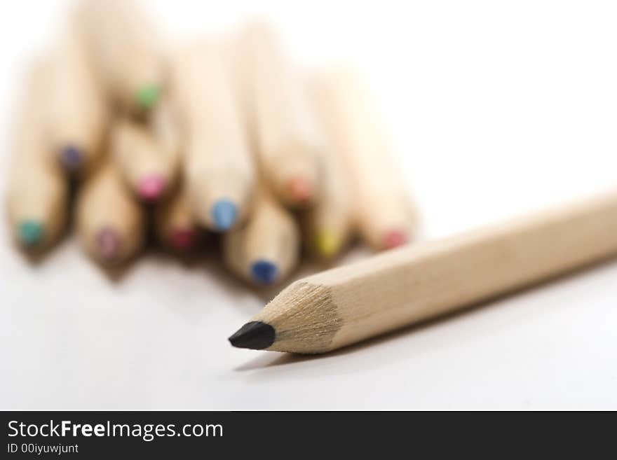 Wooden color pencils in stack isolated on white