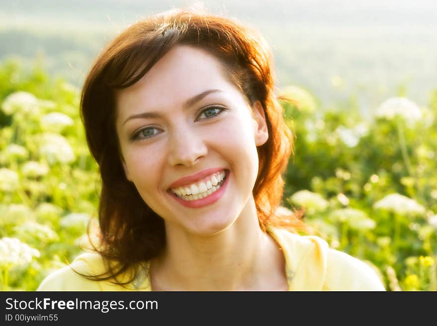 Portrait of a young woman in a meadow. Special toned and soft photo f/x. Portrait of a young woman in a meadow. Special toned and soft photo f/x