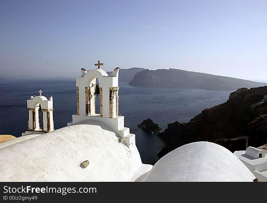 This Church overlooks the Caldera from Oia  appearing to guard the Caldera from another eruption. This Church overlooks the Caldera from Oia  appearing to guard the Caldera from another eruption.