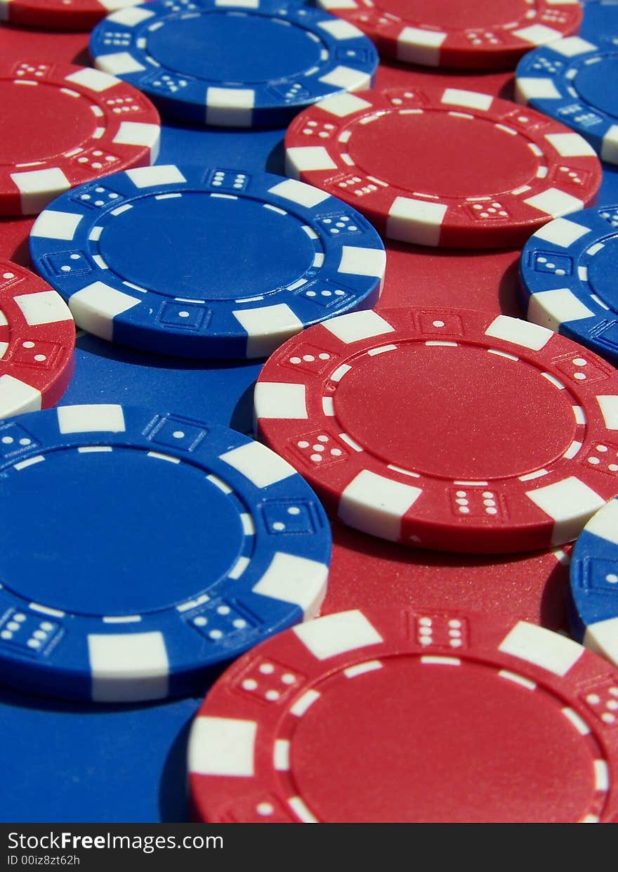 Red and blue poker chips in rows.