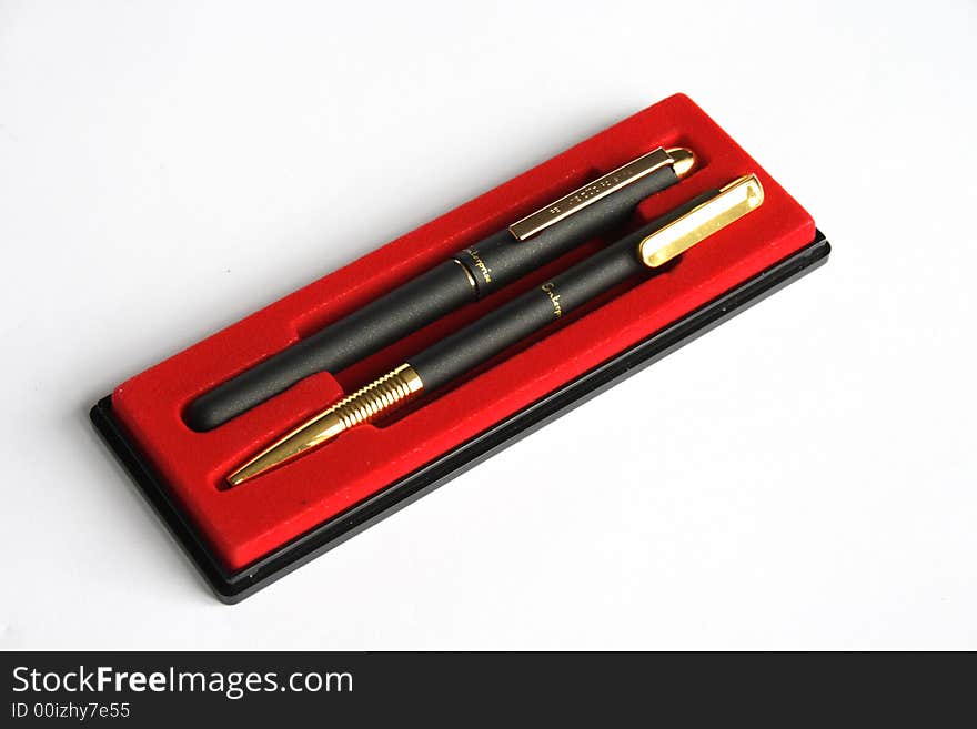 On a photo two black pens in a case.