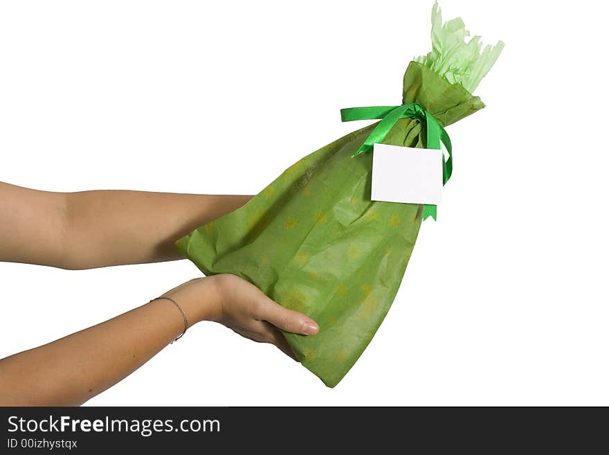 Woman holding a wine bottle with green wrap with a green ribbon over white back ground. Woman holding a wine bottle with green wrap with a green ribbon over white back ground