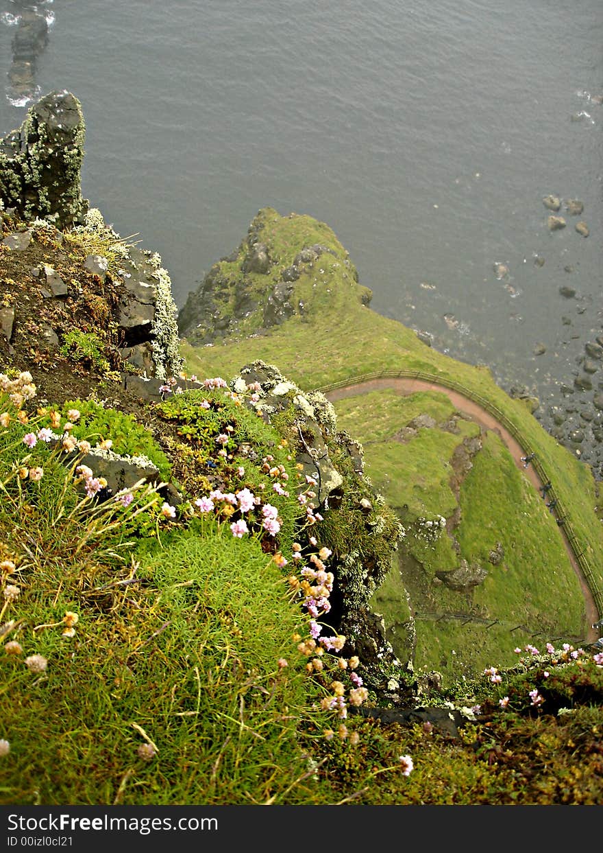 Cliffside in the mists of the Giant's Cuaseway in Northern Ireland. Cliffside in the mists of the Giant's Cuaseway in Northern Ireland