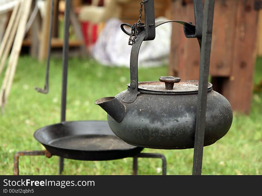 Black antique cast-iron kettle.