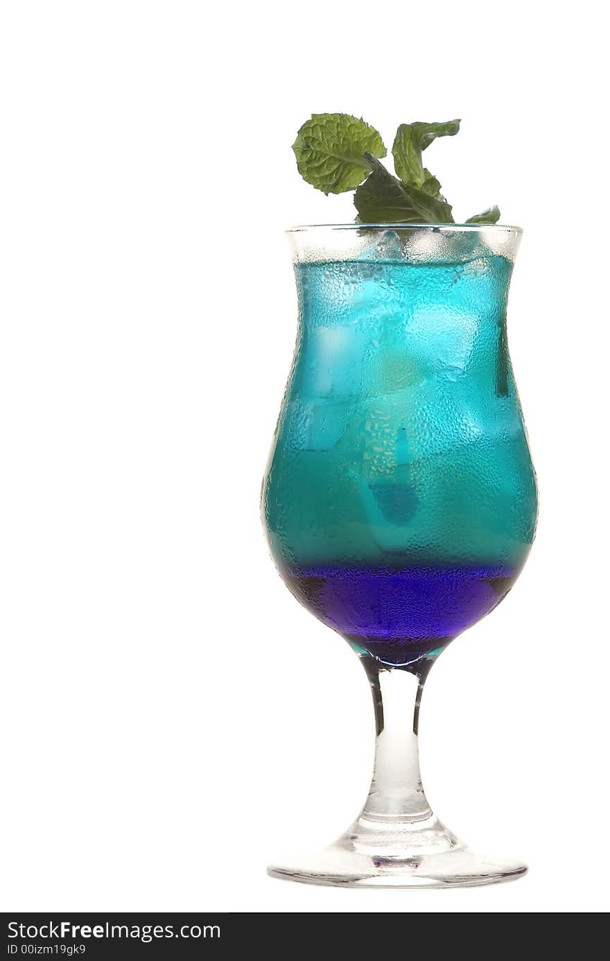 Colorful alcoholic cocktail in a glass against white background. Colorful alcoholic cocktail in a glass against white background