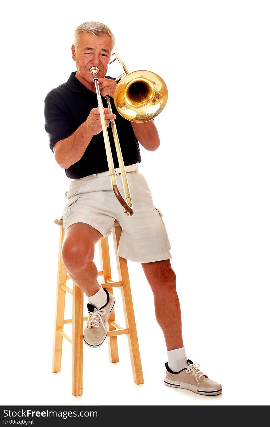 Front view of a senior man playing his trombone. Isolated on white. Front view of a senior man playing his trombone. Isolated on white.