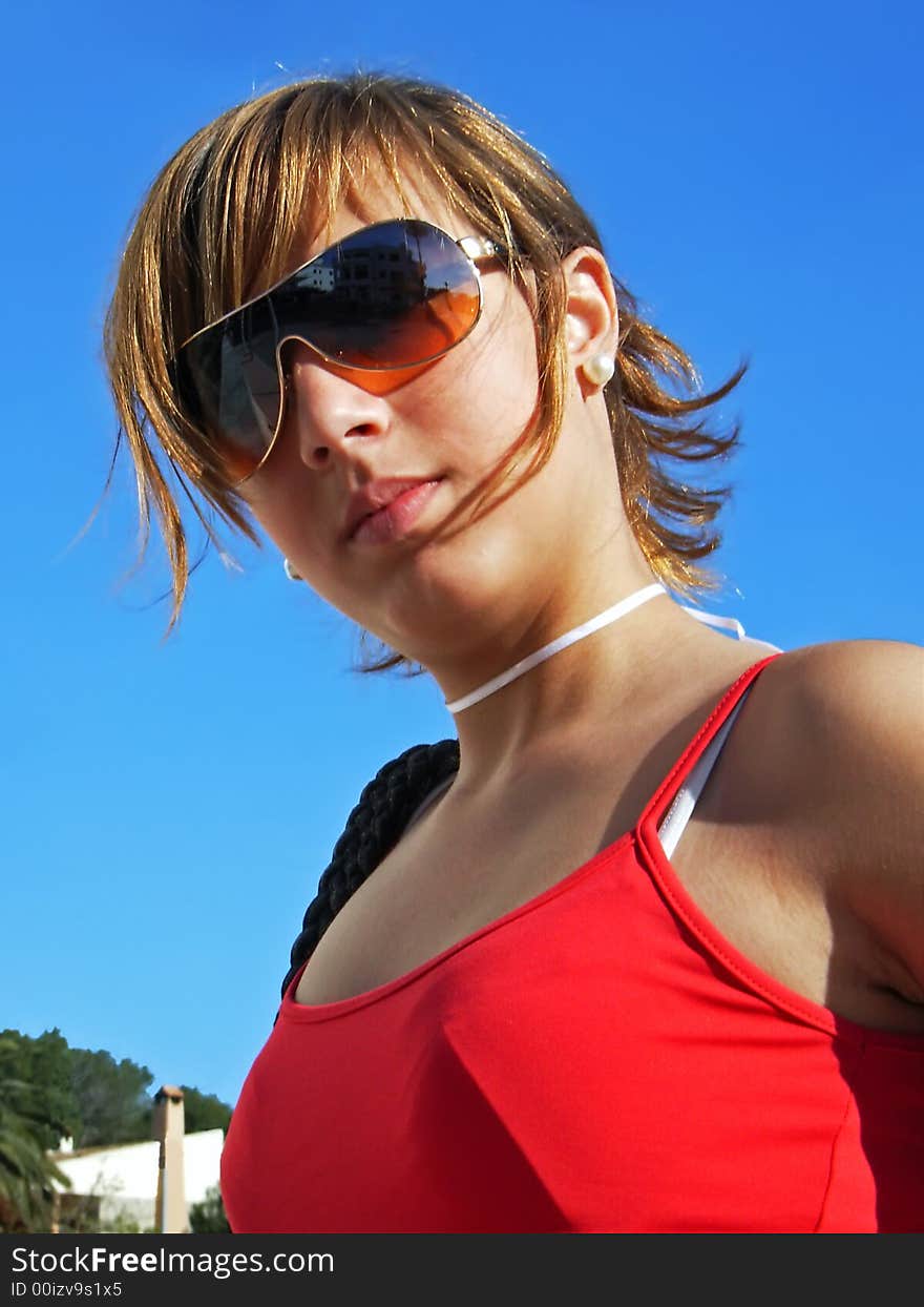 Young teenager girl with sunglasses in Majorca