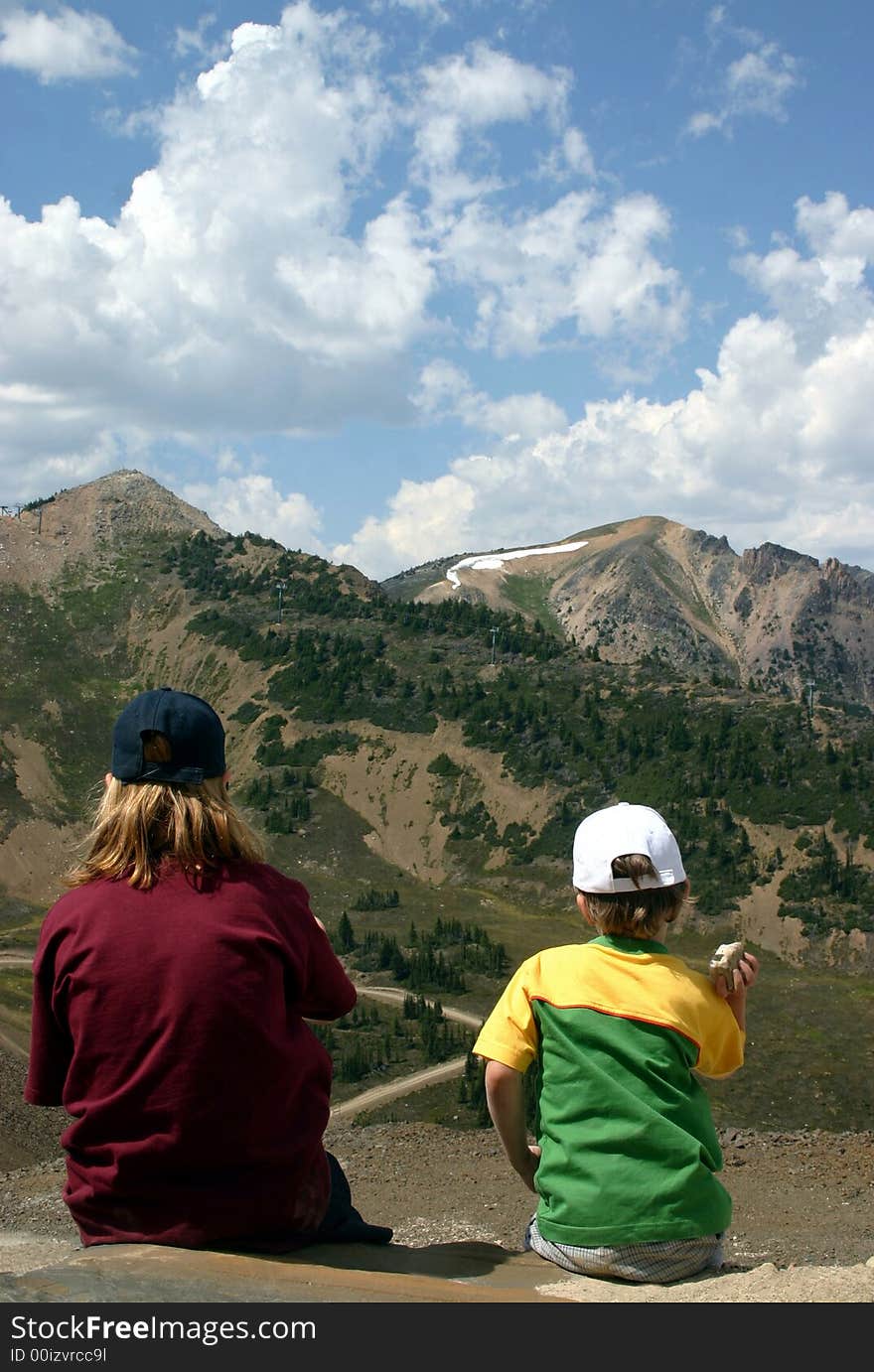 Brother and sister enjoying a mountain view. Brother and sister enjoying a mountain view.