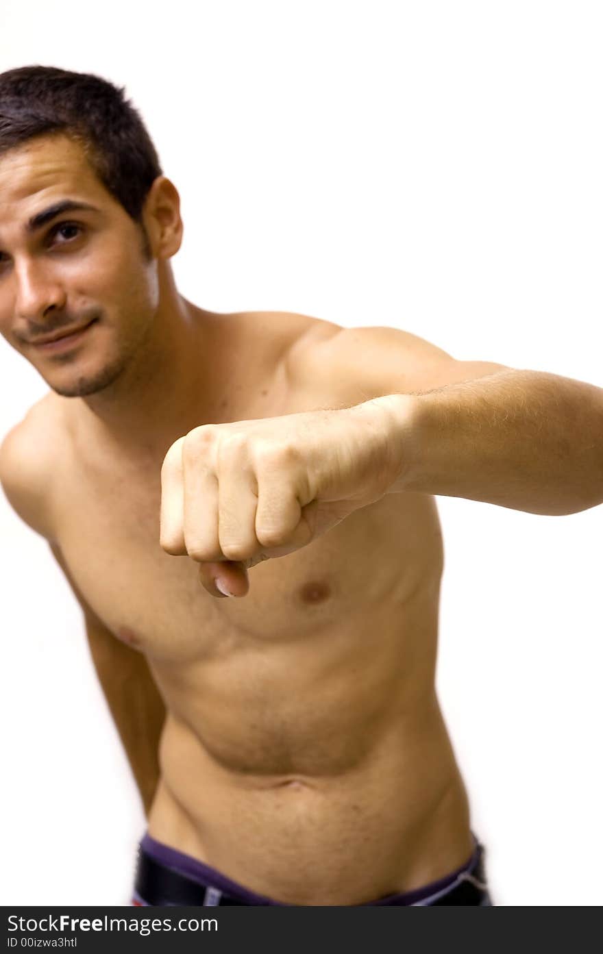 Portrait of young shirtless male punching - isolated over white background. Portrait of young shirtless male punching - isolated over white background