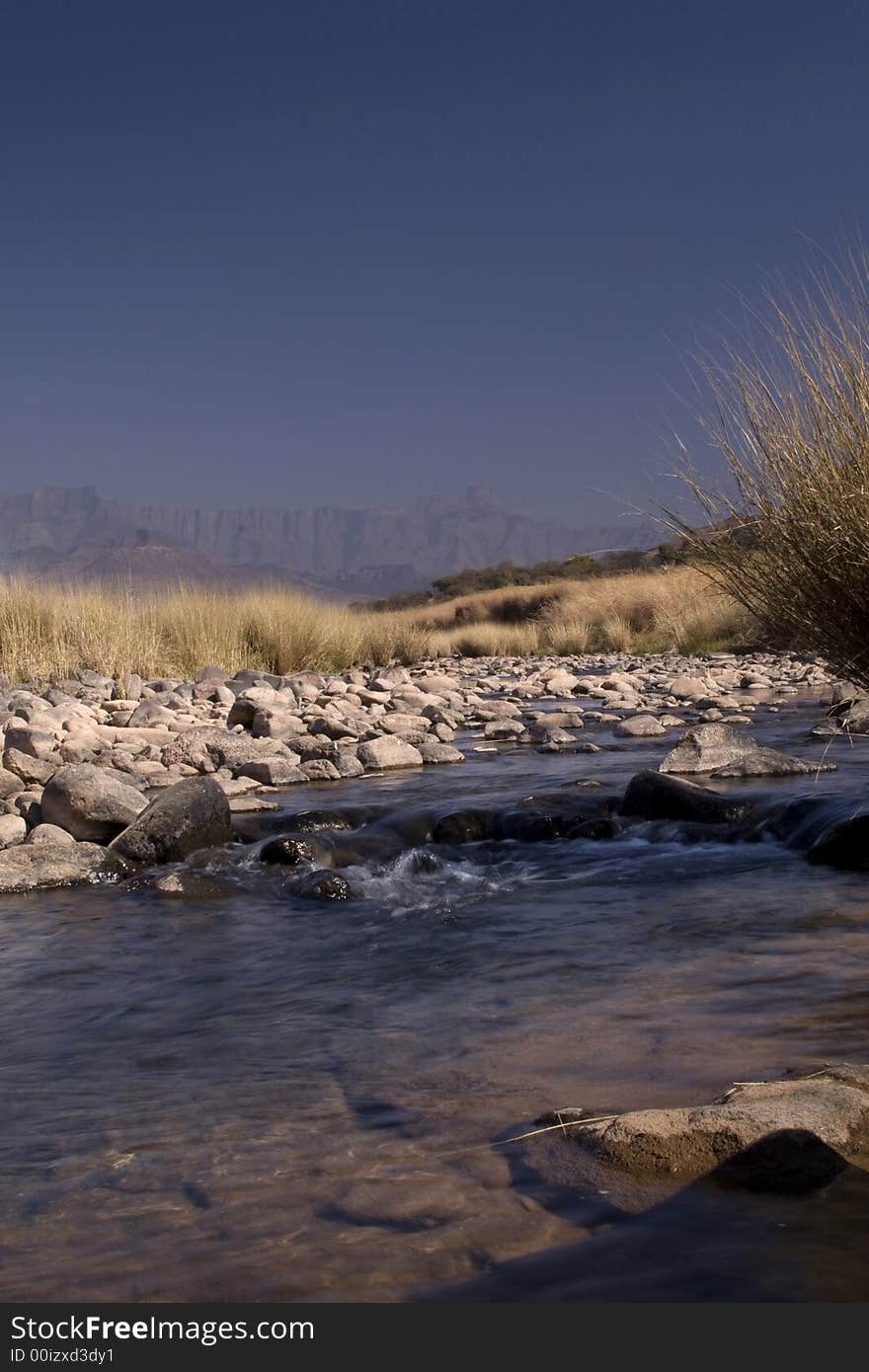 Beautiful stream in the Drakensberg with the berg in the background. Beautiful stream in the Drakensberg with the berg in the background