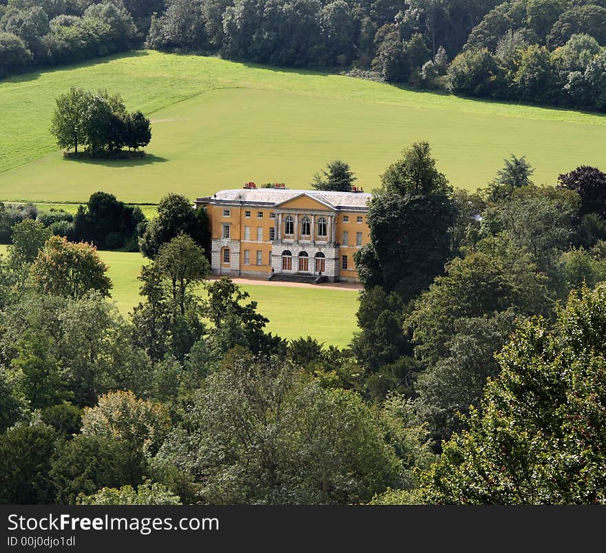 Stately Home set amongst Trees and Parkland in Rural England