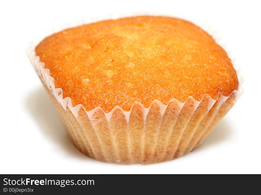 Closeup of tasty muffin isolated on white background.