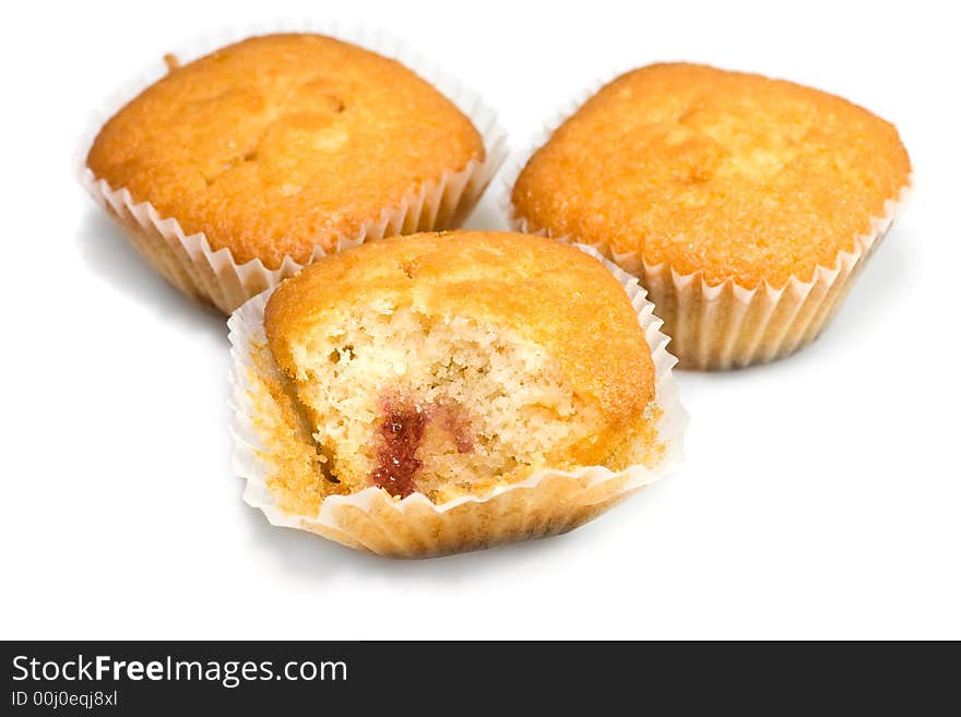 Three tasty muffins isolated on white background.