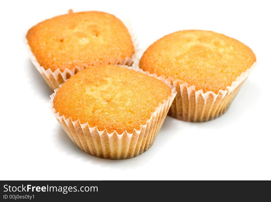 Three tasty muffins isolated on white background.