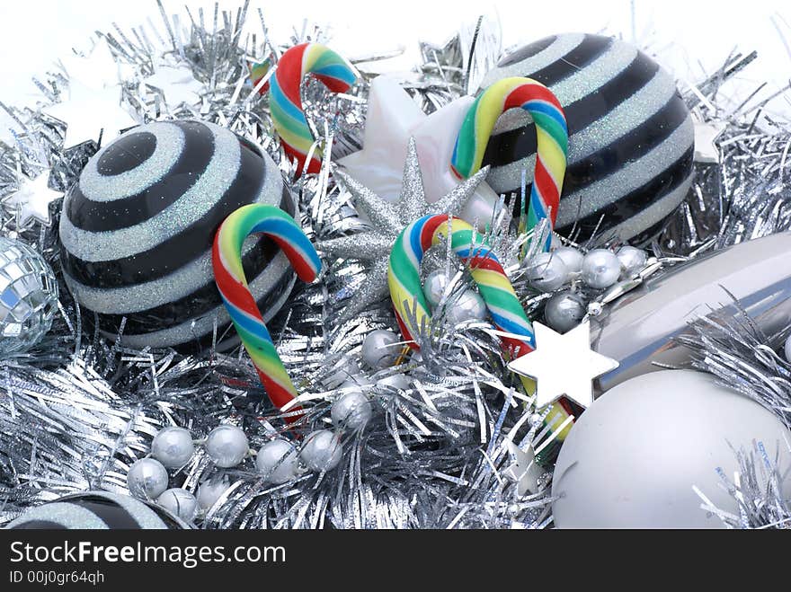 Candy canes amongst christmas ornaments. Candy canes amongst christmas ornaments.