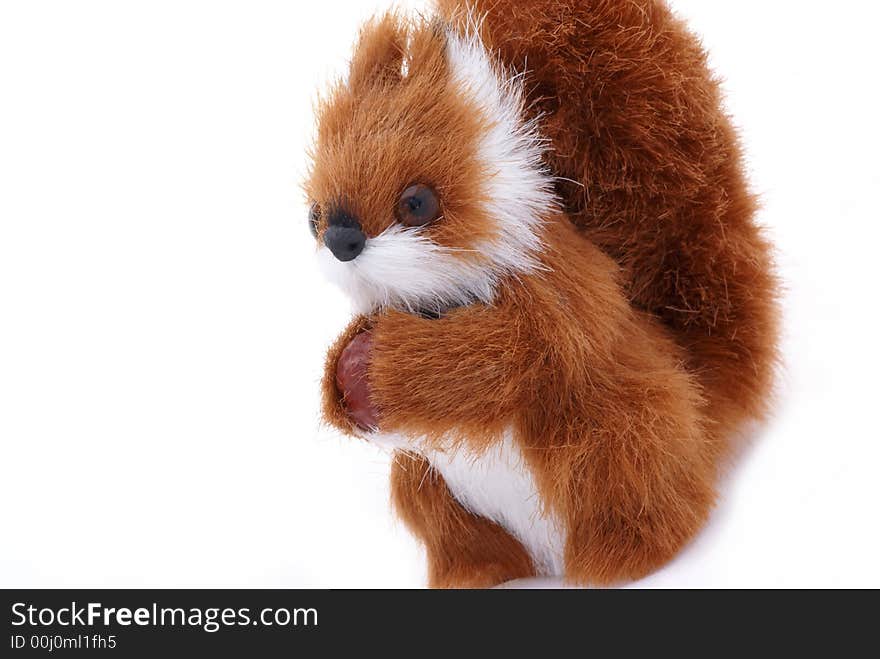 Cute plushy squirrel in front of a white background. Cute plushy squirrel in front of a white background.