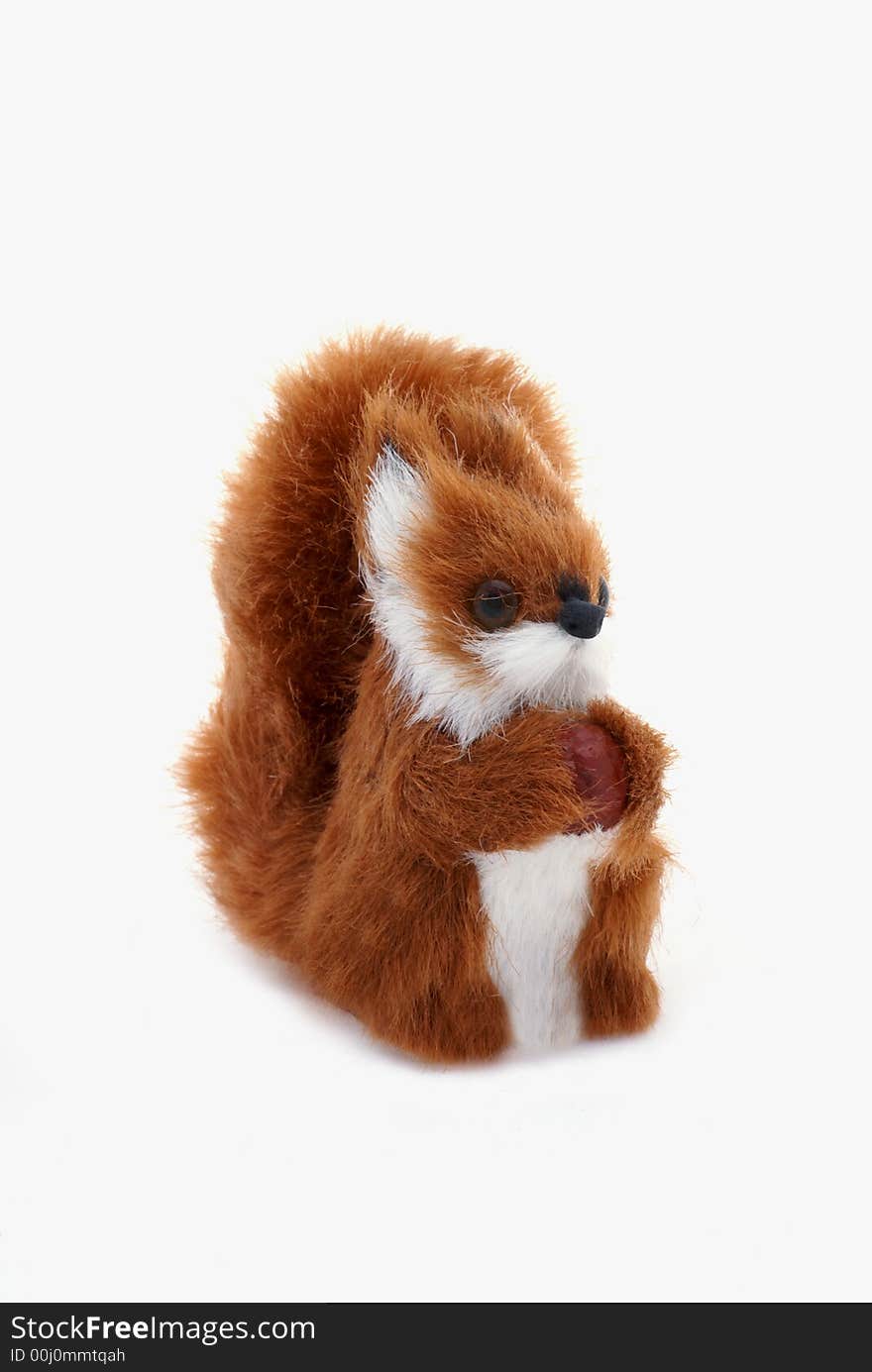 Cute plushy squirrel in front of a white background. Cute plushy squirrel in front of a white background.