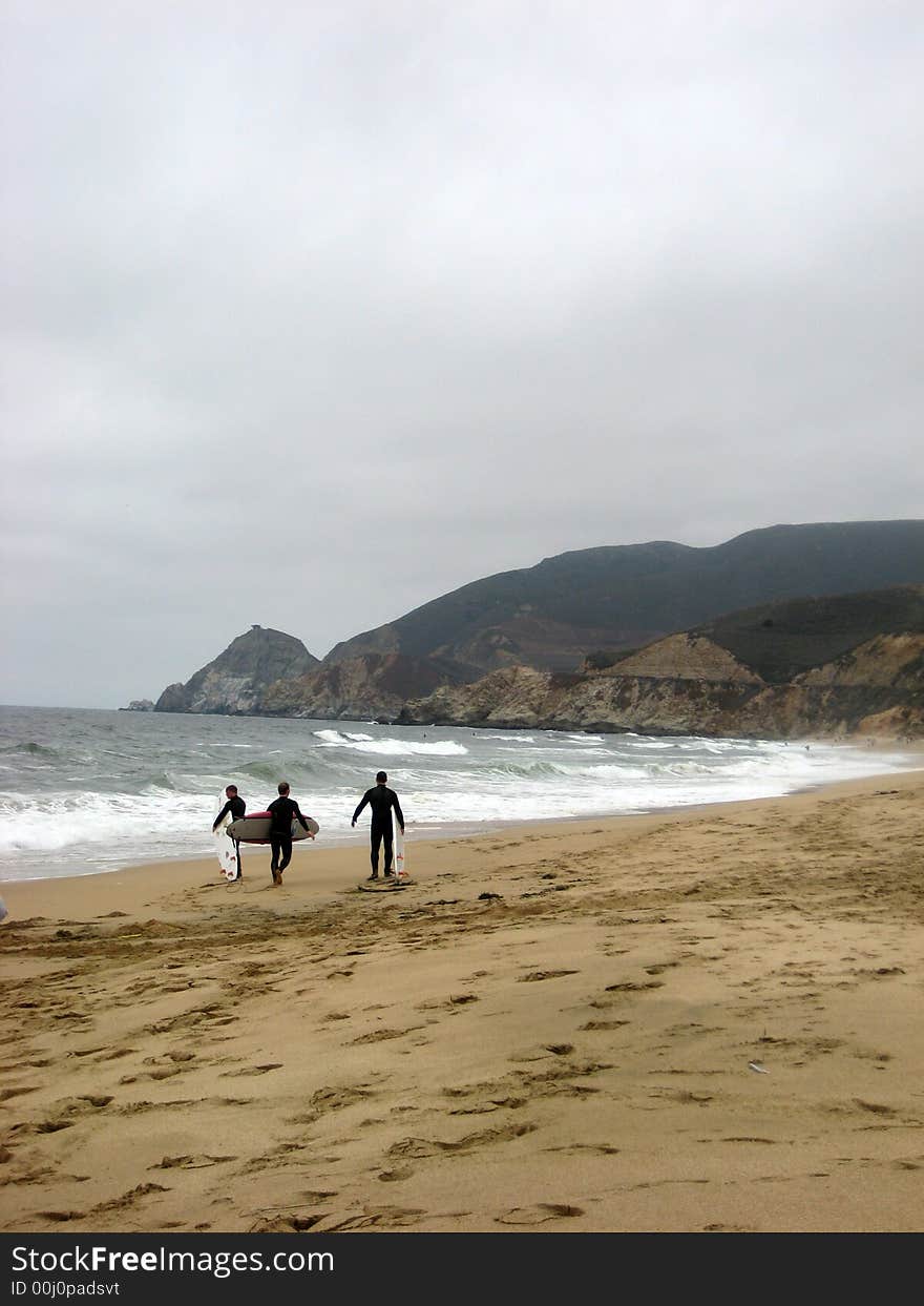 Getting ready for a day of surfing in the storm. Getting ready for a day of surfing in the storm