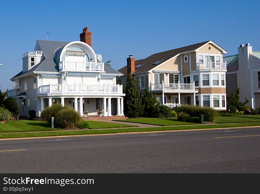 Beach houses along the New Jersey shore, with a blue sky background