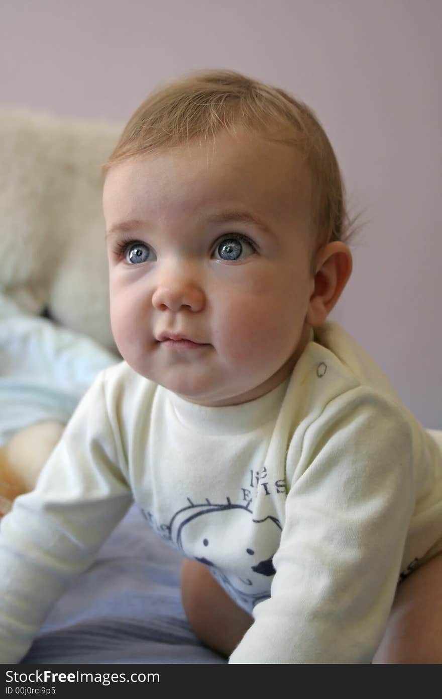 A portrait of a blue eyed baby.