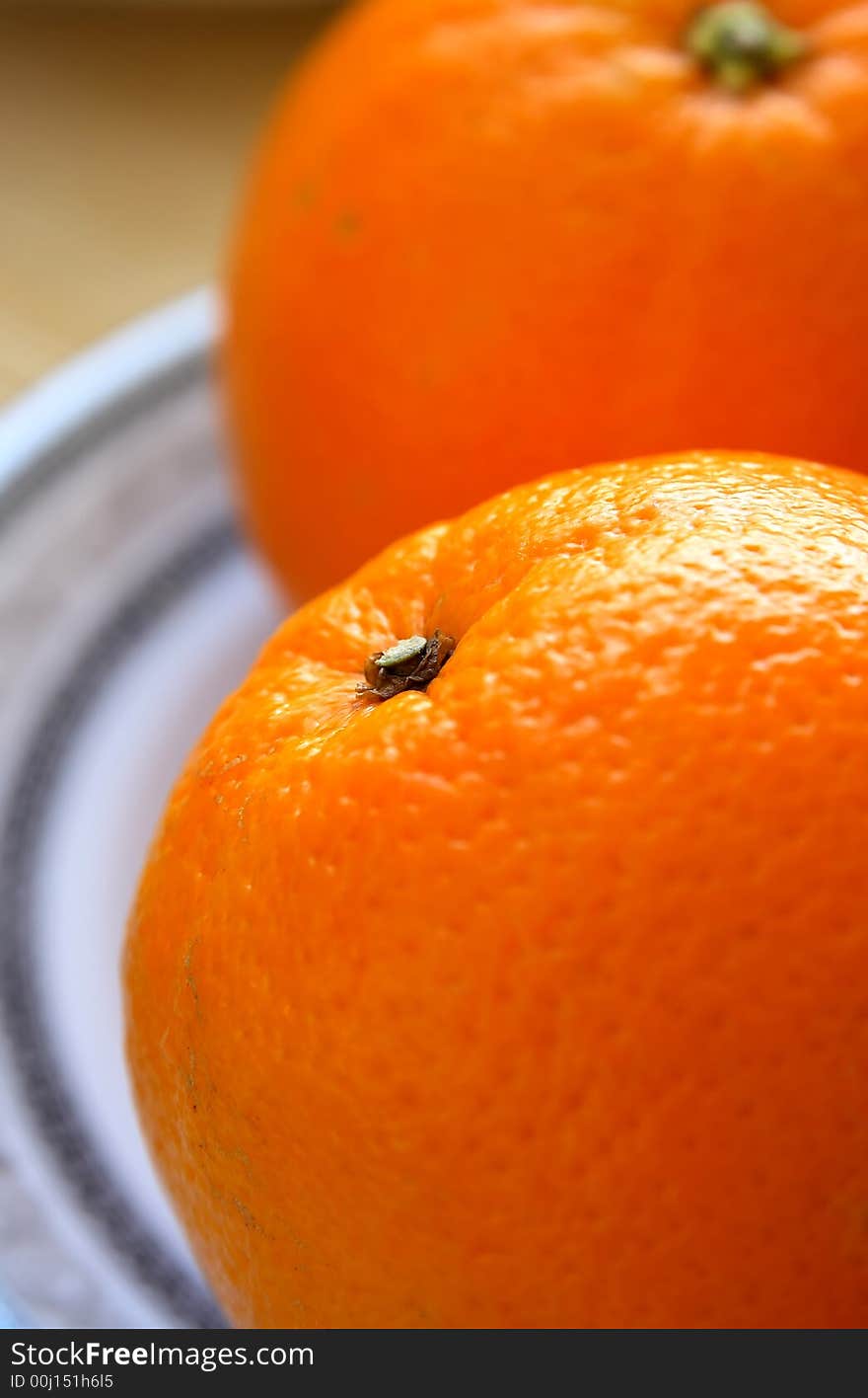 Oranges on a white plate